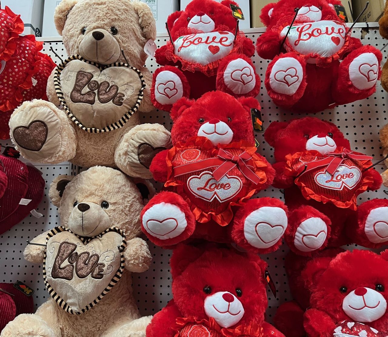 Services Cute teddy bears with 'Love' hearts perfect for Valentine's Day gifts.
